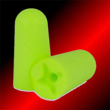 Close up of two bright green soft foam earplugs for snoring prevention